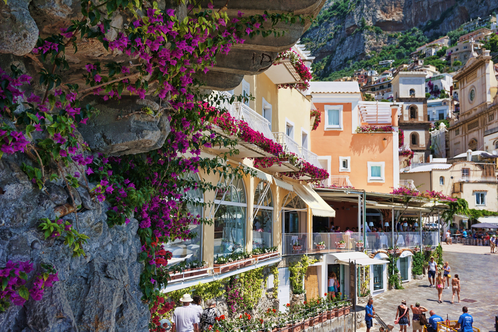 Beautiful flowers cover all houses in Positano, Italy